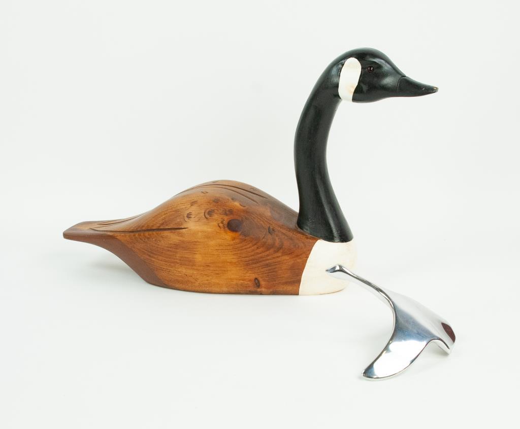 Carved Goose Decoy & Hoselton Goose Sculpture: 1. Carved and painted wood goose decoy, signed on base "Patrick ???? 99"; approx. 20 1/2"L, 12 1/4"H; good condition---2. Polished aluminum sculpture of a Canadian goose, signed on base "Hoselton / Ca