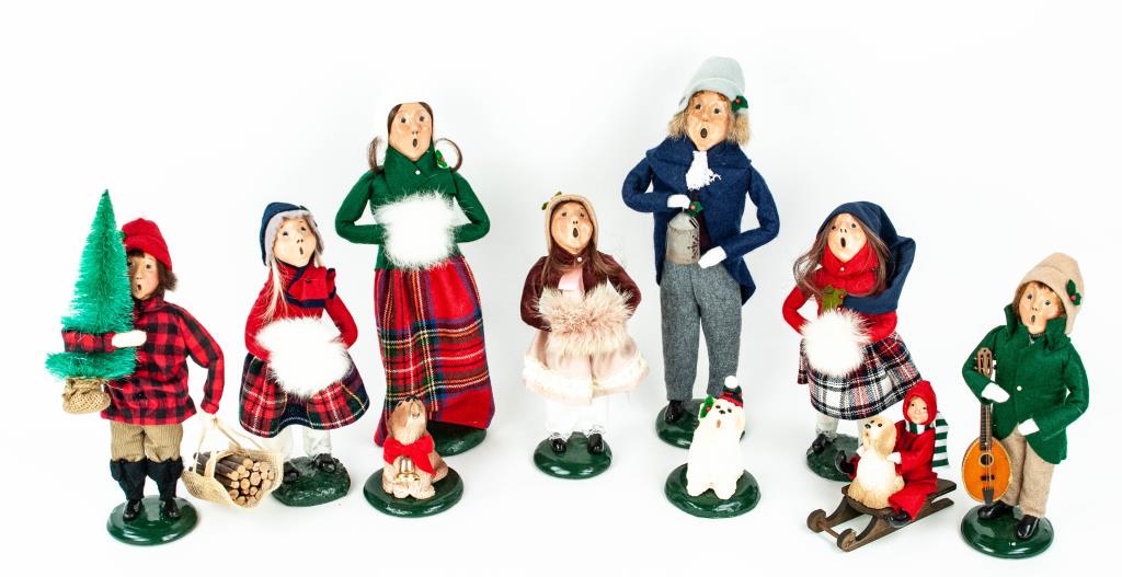 Ten Byers Choice Christmas Carolers: 1988 male holding lantern---1987 female with hands in white faux fur muff---1991 young boy holding a Christmas tree and firewood---1983 young girl with hands in white faux fur muff---1988 young girl w