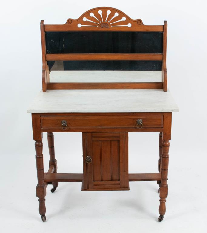 19th C. Cherry Marble Top Dressing Table: Backsplash having a carved fan-like crest over mirror, rectangular marble top over long dovetailed drawer, turned legs on casters, cross stretcher centered with a small storage cabinet; 33"W, 19 1/4"D