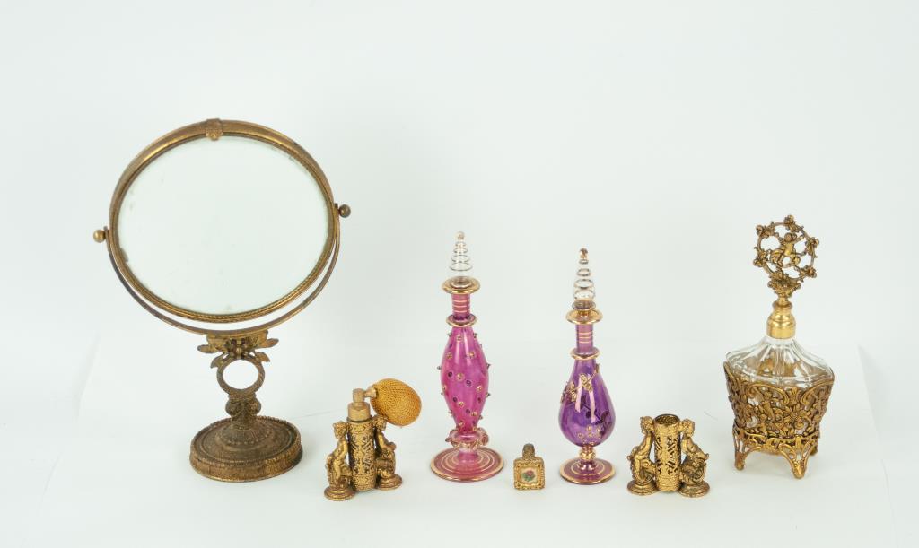 Perfume Bottles & Other Dresser Accessories: Seven vintage items: 1. Clear glass miniature dauber perfume bottle having a gilt metal openwork frame and floral needlepoint design to front; 1 1/4"H, 7/8"W---2. Perfume atomizer and matching lipstic