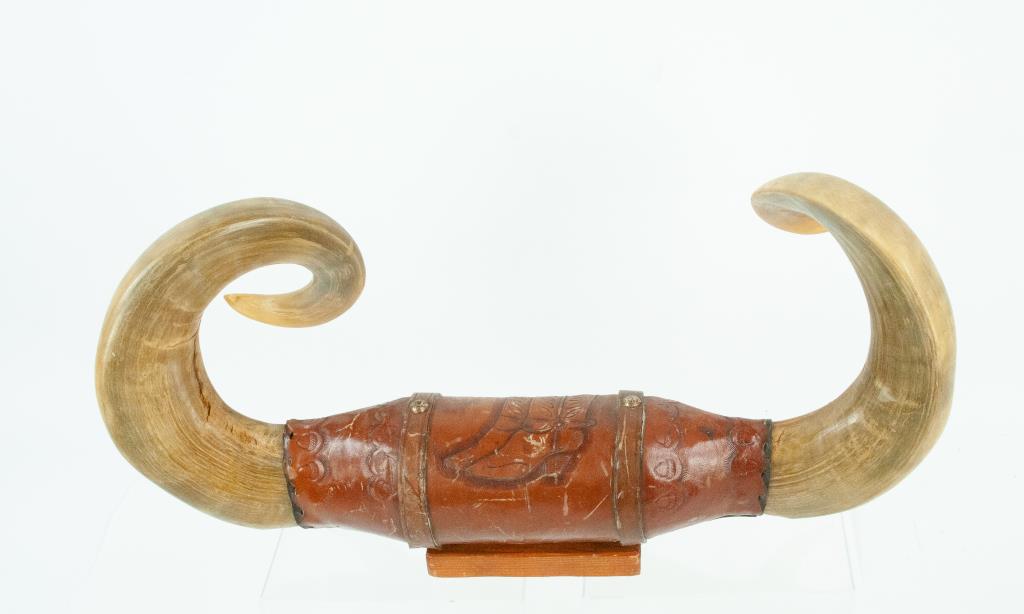 Wall Mount Bull Horns: Set of bull horns, center wrapped in tooled leather decorated with a pair of cowboy boots and bands of acorns; 19 1/4"L