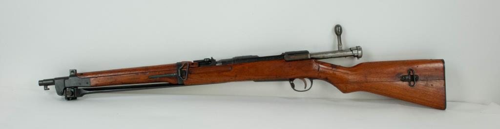 Japanese Arisaka Rifle with Folding Bayonet: Arisaka short rifle with folding bayonet, manufactured for the Imperial Japanese Army and retains chrysanthemum stamp of the Emperor, SN30827, smooth metal with good markings; 38 1/4"L without bayonet