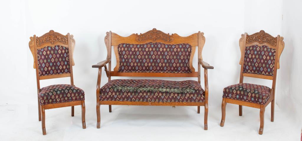 3-Piece American Eastlake Carved Oak Parlor Set: c. 1900; settee and two chairs with carved crests, upholstered backs and seats, cabriole legs; settee 51"W, 40"H, 27"D; chairs 19"W, 19"D, 40 1/2"H; one rear arm support missing on settee, extensive w