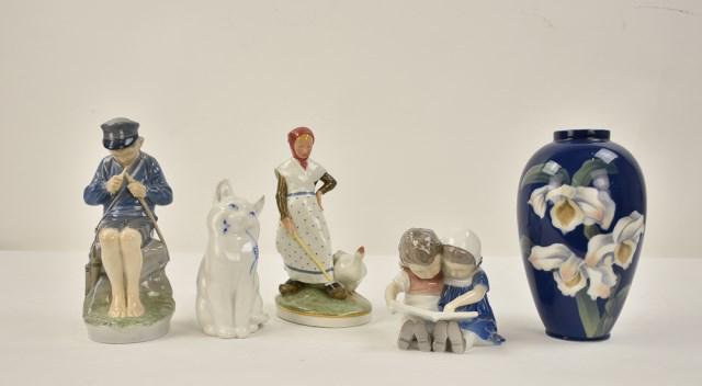 Five Pieces Royal Copenhagen, B&G Porcelain: 1. Girl with goose, Royal Copenhagen, #528; 7 1/4"H---2. Boy whittling, Royal Copenhagen, #905; 7 1/4"H---3. Cat, Royal Copenhagen; 5 1/2"H---4. Vase having floral decoration on a deep blue ground, Ro