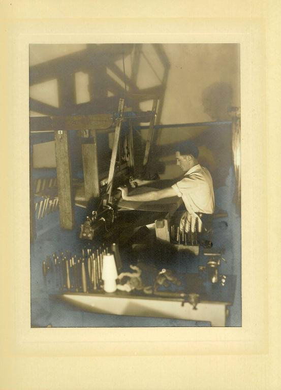 Doris Ulmann Photograph Platinum print Mountain Wea: Doris Ulmann Photograph Platinum print Mountain Weavers: side view of young man at loom, Berea, Kentucky, unsigned Doris Ulmann (1882-1934), 8 x 6 in., framed in 14 x 11 in. mat (Photograph was person