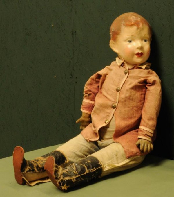 Early Cloth Bodied Boy Doll Painted face; original m: Early Cloth Bodied Boy Doll Painted face; original military style clothing with faded red jacket and faded blue slacks having a white stripe down the side of each leg; black cloth boots; 31" tall; ext