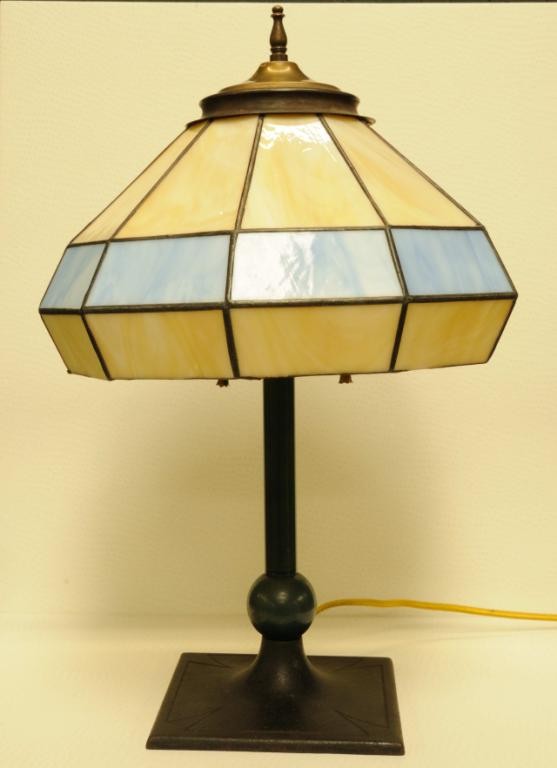 Arts & Crafts Lamp w/ Leaded Glass Shade A Maltese : Arts & Crafts Lamp w/ Leaded Glass Shade A Maltese Cross decorates the square metal base; shaft painted green; shade with blue and caramel panels; double light socket with pull chains; 16 3/4"H, 5 3/4