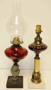 Two American Cranberry Glass Lamps: 1. Brass post with marble base; font with intaglio vine decoration, cranberry cut-to-clear glass; 16"H to top of socket; electrified; minor chips to base; some corrosion to brass column; 2. 