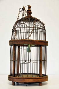 C. 1890 Dome Top Birdcage: Wooden frame with wire grill; small oxidized copper hummingbird on perch; trap door in bottom; retains original 53 1/2" wire chain; 17 1/2"H, 9" diameter