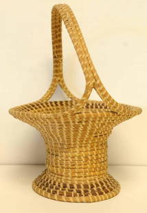 Charleston, South Carolina, Sweetgrass Basket: Footed and with handle; 14 1/2"H; 10 3/4" rim of basket diameter; 7 1/4" base diameter