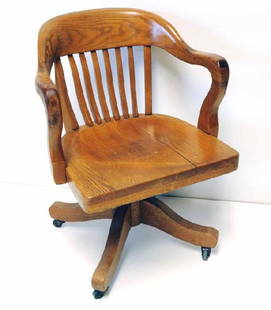 Oak Swivel Desk Chair w/ Arms: Early 20th century; label for "Pound & Moore Co., Charlotte, North Carolina"; 32"H, 23"W, 19"D