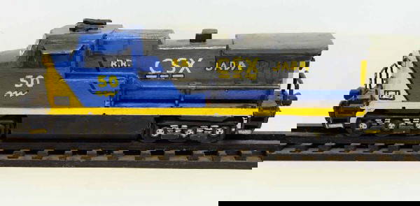 Railroad--Folk Art CSX Locomotive: Hand-made and painted wooden CSX locomotive sitting on hand-made and painted wooden rails and ties; locomotive 19"L; track 38"L, 3 1/4"W