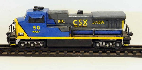 Railroad--Folk Art CSX Locomotive: Hand-made and painted wooden CSX locomotive sitting on hand-made and painted wooden rails and ties; locomotive 19"L; track 38"L, 3 1/4"W