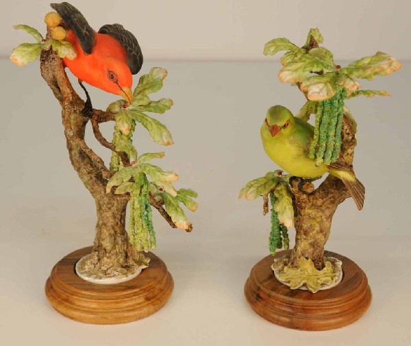 Pair of Dorothy Doughty Bird Figurines: Scarlet tanagers and white oak; male and female; on fitted wooden bases; both with black printed Royal Worcester mark and Dorothy Doughty signature; 11 1/2"H and 12"H; appear to be in excellent condit