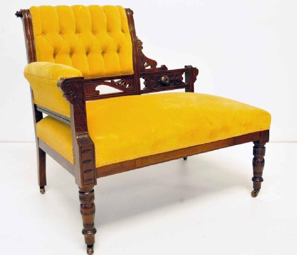 Walnut Eastlake Parlor Settee: Circa 1900; asymmetrical form on casters; gold velvet upholstery with tufted back; 34 1/4"W, 32 3/4"H, 20"D;