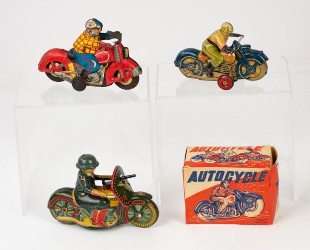 3 Japanese Tin Litho Motorcyle Toys: 1. Friction "Autocycle", made by Alps and in original box; 4 1/2"L, 3"H; good condition with small losses to paint, box with creases and dents---2. Harley Davidson friction racing motorcycle, driver w