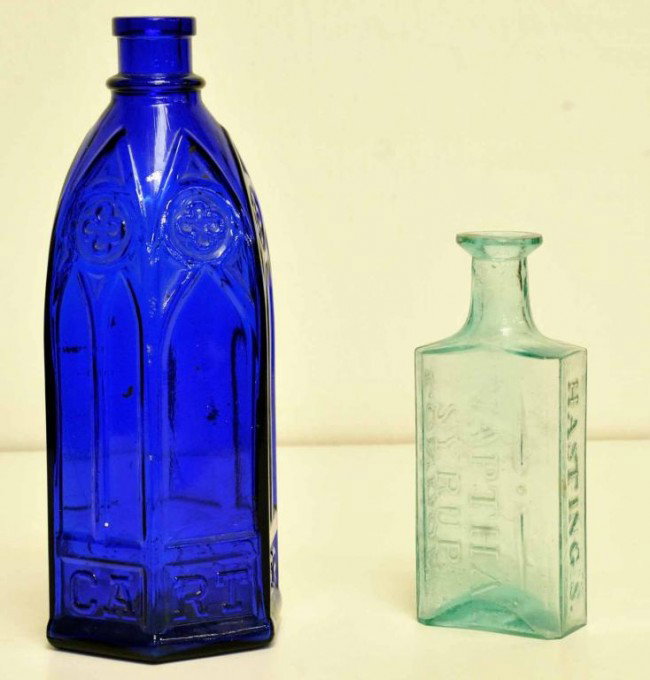 Hasting's Naptha Syrup & Carter's Ink Bottles: 1. Aqua bottle with broken pontil; embossed "Hasting's Naptha Syrup London"; 6 1/2"; two small rim chips; 2. "Carter's" cobalt blue hexagonal cathedral style ink bottle; 9 3/4"