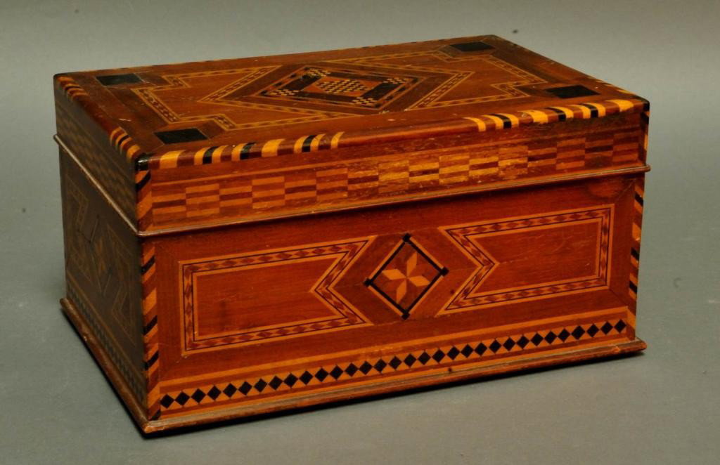 Extensively Inlaid Mahogany Humidor: Elaborate geometric inlay on lid and all sides; top with checkerboard central medallion; each side with star-shaped central medallion; tin lining; 12 1/4" x 7 3/4", 6 1/4"H; minor surface abrasions co