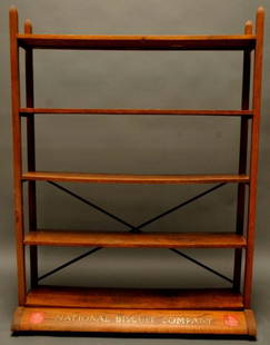 Nabisco National Biscuit Co. Country Store Rack: Oak general store display rack with five shelves; front of base reads "National Biscuit Company"; raised on casters; 61 1/4"H, 46"W, 20"D overall; shelves 10 1/4"D; good condition, finish 