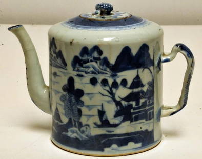 Chinese Export Porcelain Canton Teapot: Intertwined handle, berry finial to lid; blue and white decoration; 19th century; 5 1/2"H; small chip to spout