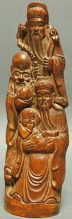 Chinese Wooden Carved Figural Statue: Carved as a tower of three older men, the lower one holding a baby in is arms and the higher one with a dragon at his side; 18"H; small loss at base of middle man