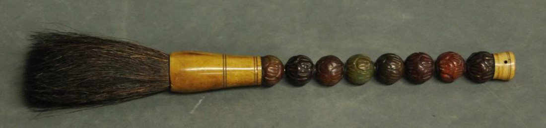 19th Century Oriental Brush: Handle made of carved stone beads with carved bone at either end; horsehair brush; 12 1/2"L; age crack to small bone tip on brush handle