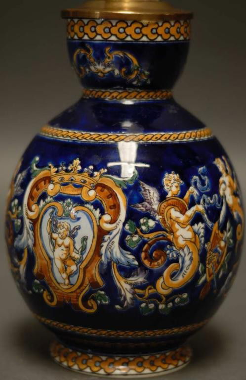 French Gien Lamp: Hand decorated with dragons, birds, winged figures, and putti on a cobalt ground; 13"H to top of socket