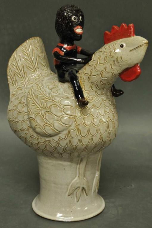 South Carolina Folk Pottery, Robert Stevens: Multi-colored glaze; black man astride a chicken; incised on chicken "Robert Stevens S.C."; approximately 16"H