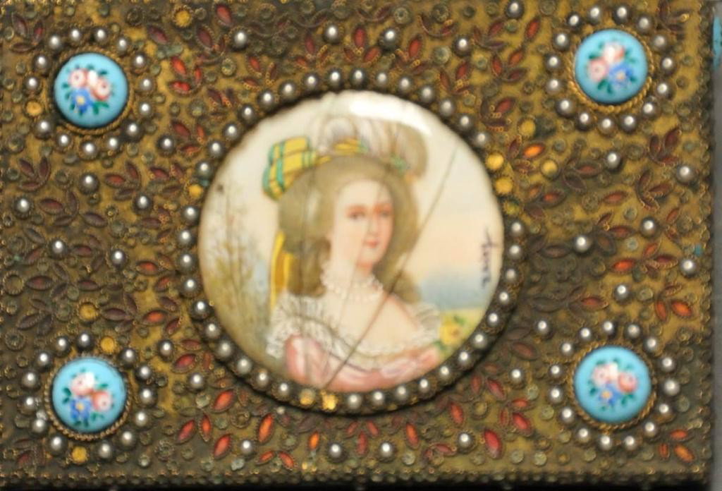 Brass Jewelry Box w/ Miniature Portrait: Top centered with a circular hand painted miniature portrait of woman in feathered hat, artist signed "Daisy" at right; box heavily decorated overall with an applied metal, enameled floral pattern and
