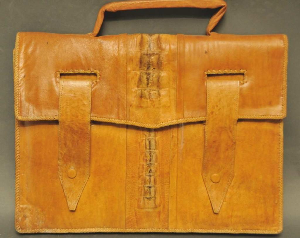 Mid Century Alligator/Crocodile Briefcase: Accordion case opens to two compartments and a zippered pouch; two belt straps with metal fasteners; 17 1/4"W, 13"H without handle; stain to right back corner