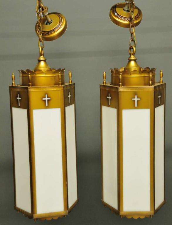 Pair of Pendant Chandeliers: Hexagon with antique gold finish and white acrylic panels; manufactured by McFadden Lighting, St. Louis, MO; chains and ceiling caps included; approximately 12 1/2" diameter; approximately 31" from ba