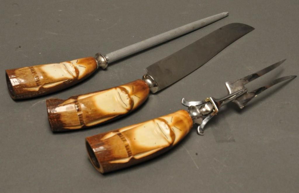 3-Pc. Solingen, Germany Carved Horn Cutlery Set: Each handle carved with caricature; includes cutlery knife, meat fork, sharpening steel; knife blade marked "Henley & Co./Germany" and "Solingen/Stainless"; fork marked "Stainless/Germany"; sharpening