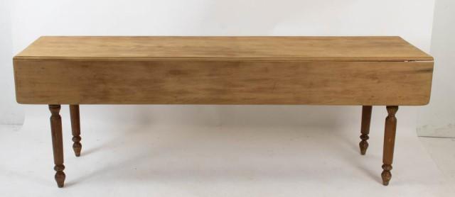 American Slender Drop-Leaf Wake Table: Cherry, pine secondary, peg construction, long and slender rectangular top having drop leaves with rounded ends, turned legs, late 19th / early 20th century; 84"L, 29 1/2"H, 21"D with leaves down and