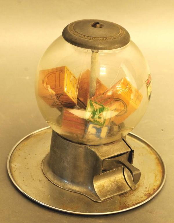 c. 1948 Table or Bar Top Vending Machine: Five-cent aluminum with glass globe table or bar top vending machine mounted to a circular tray; aluminum cap embossed "Pat. & Mfg. by Abbey Mfg. Co. St. Louis & Los Angeles, U.S.A."; original decal o