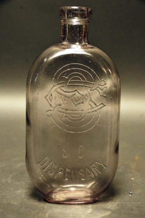 South Carolina Dispensary Pint Bottle No. 201: Clear pint bottle No. 201 with monogram; "C.G. Co." embossed on base of obverse side, "135" embossed on bottom; #201 of "The South Carolina Dispensary A Bottle Collector's Atlas and History of the Sys