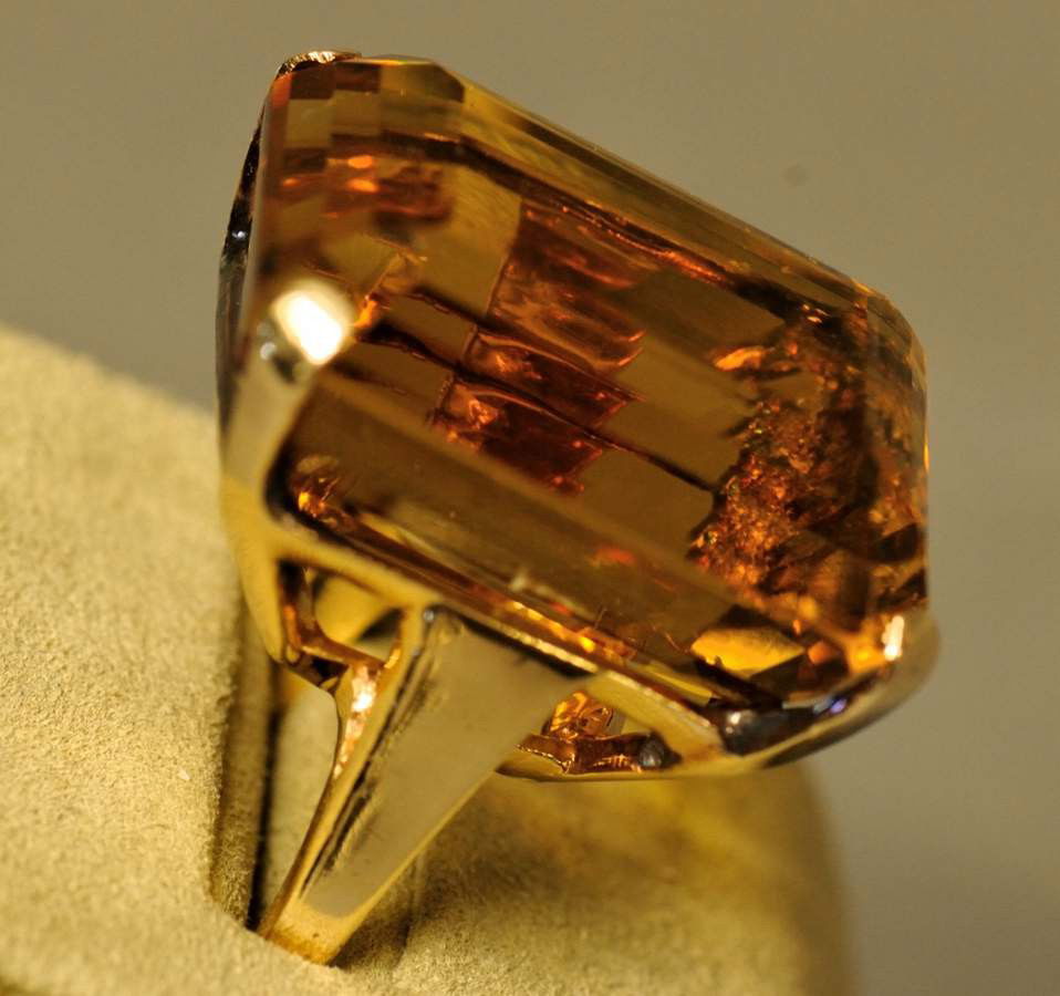 14K Large Citrine Ring, c. 1930-40: Emerald cut citrine approximately 78 ct.; size 8 3/4; small chip to one corner