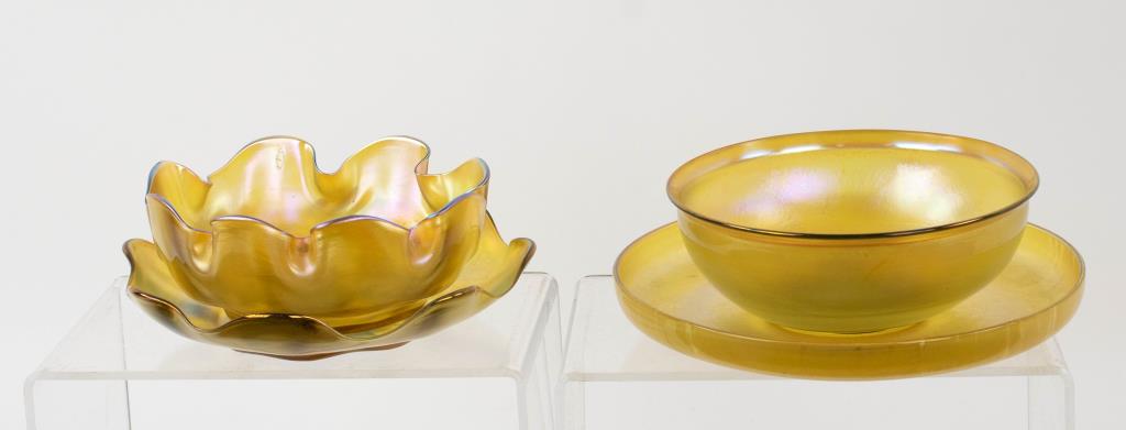 2 Tiffany Favrile Glass Finger Bowls, Underplates: Two Favrile iridescent gold glass finger bowls and underplates by Tiffany Studios, first quarter 20th century: 1. One set with a delicately undulating rim on each piece, bowl signed to the underside "