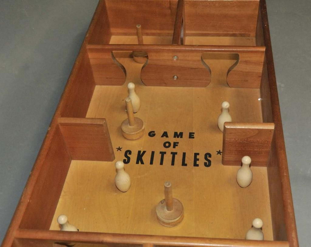 antique skittles game with wooden pins and iron bumbers antique skittles game with wooden pins and iron bumbers