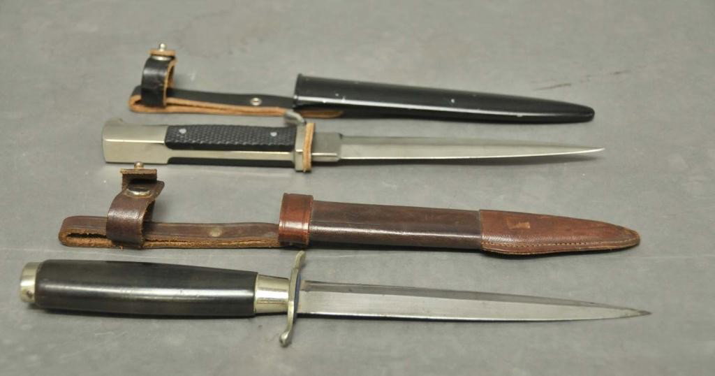 Two German Daggers--Schlieper & Wingen: 1. Fixed blade knife in leather belt sheath; blade marked "Carl Schlieper/Solingen Germany"; 6" blade; 2. Fixed blade knife in leather and black metal belt sheath; ricasso marked one side "Anton Winge