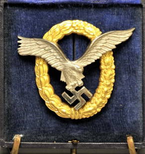 Cased German Nazi Luftwaffe Pilot/Observer Badge: Luftwaffe eagle clutching a swastika, gilt laurel and oakleaf wreath; unmarked, probably a period wartime jeweler's copy for officer; in original presentation case with gilt embossed lid 