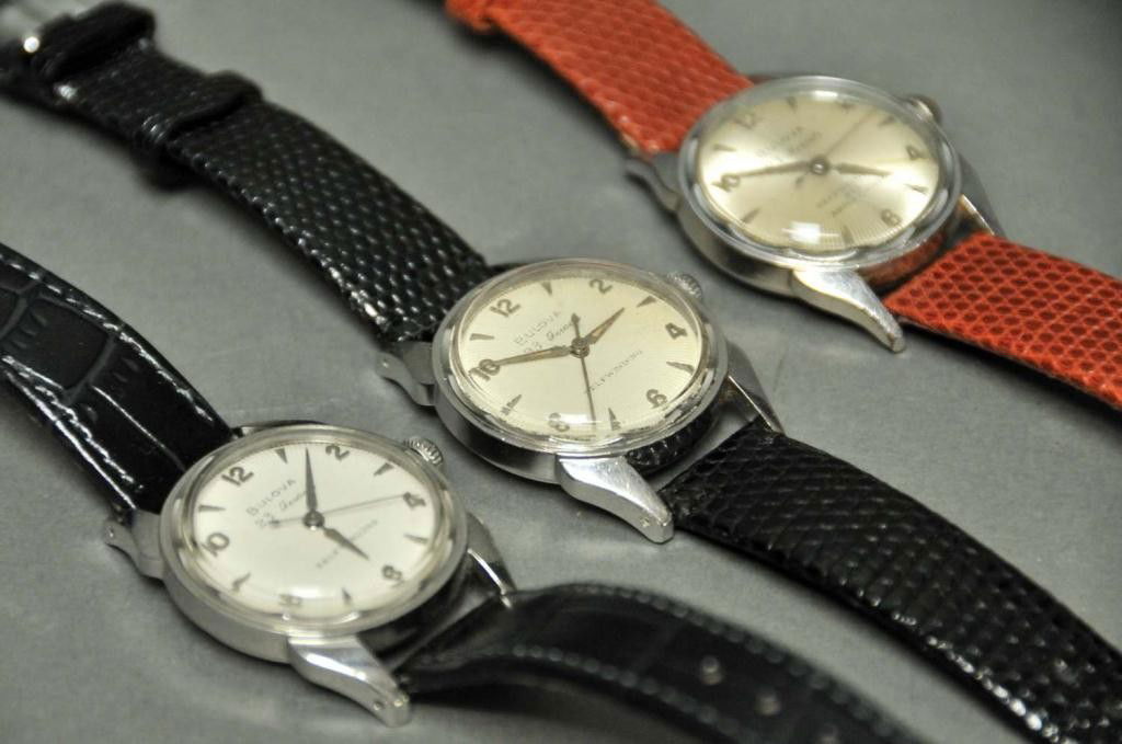 3 Bulova Man's Wristwatches w/ Hirsch Bands: 1. c. 1955 with sunburst dial, 23 jewel movement, six adjustments, self winding, waterproof; stainless steel back; Hirsch lizard band; 2. 23 jewel movement, self winding, waterproof; stainless steel b