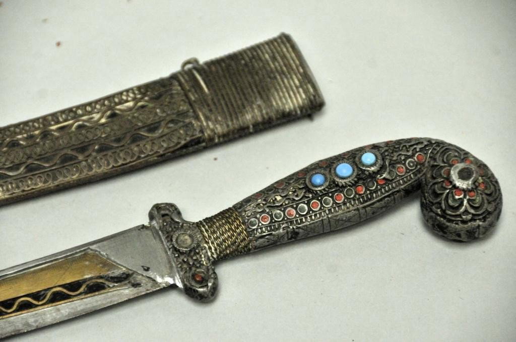 Middle Eastern Jambiya Dagger: Curved blade with gilt metal inlay both sides; hilt and scabbard with metalwork and enameled decoration, hilt with inset hard stones; 15 1/2L; several stones on hilt missing, losses to enameling