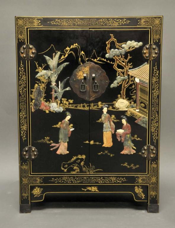 Chinese Black Lacquer Cabinet: Sides and front decorated with appliques in carved colored soapstone, the sides with birds perched on flowering branches, the front with three figures in landscape scene; gilt scrollwork and decoratio