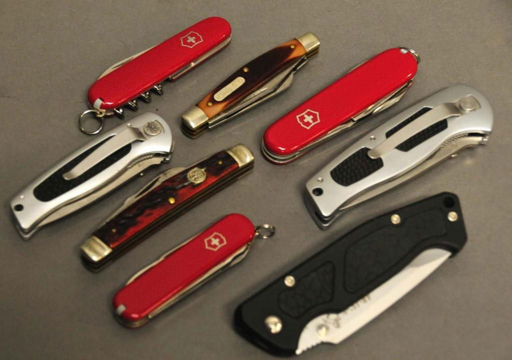 Eight Pocket Knives: 1. Boker four-blade, 3 3/4"L; 2. Schrade Old Timer three-blade, 3 3/8"L; 3. Victorinox Swiss Army knife, 3 1/2"L; 4. Victorinox Swiss Army knife, 3 1/4"L; 5. Victorinox Swiss Army knife, 3"L; 6. Unite