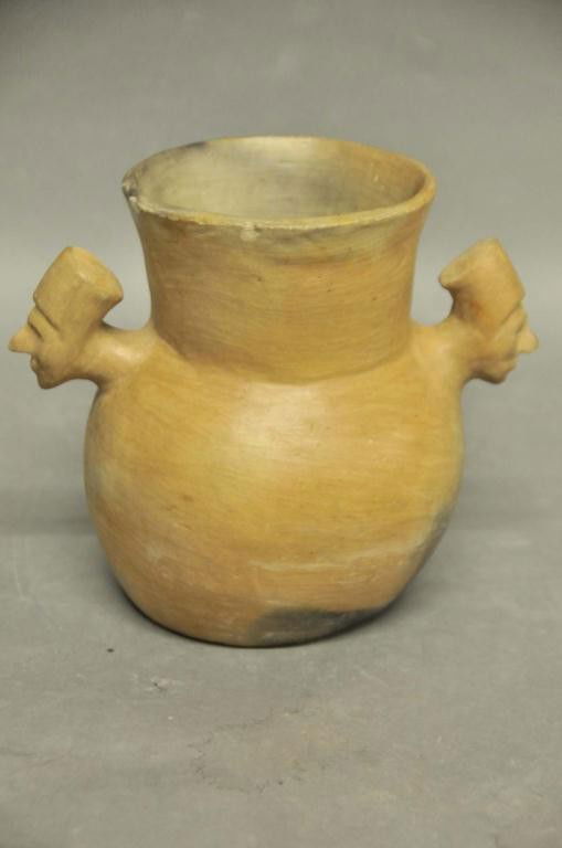 Catawba Pottery Chief's Head Vessel: Burnished and molded earthenware pot with flared neck, each side features a Chief's head with headdress; c. 1926; 7 3/4"H, 9"W; rim chips, chip to nose of each Chief's head