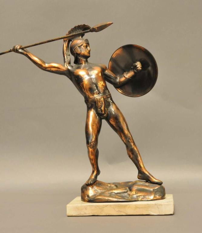 Bronze Statue of Spartan Warrior: Depicted standing on rock formation with spear and shield raised for battle; mounted on rectangular marble base; 13 1/4"W, 3 5/8"D, 13"H