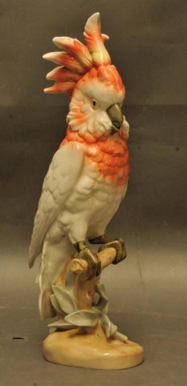 Large Royal Dux Porcelain Cockatoo: Colorful cockatoo seated on a branch; 16"H; raised pink triangle mark with green printed mark; Czechoslovakia; mid to late 20th century