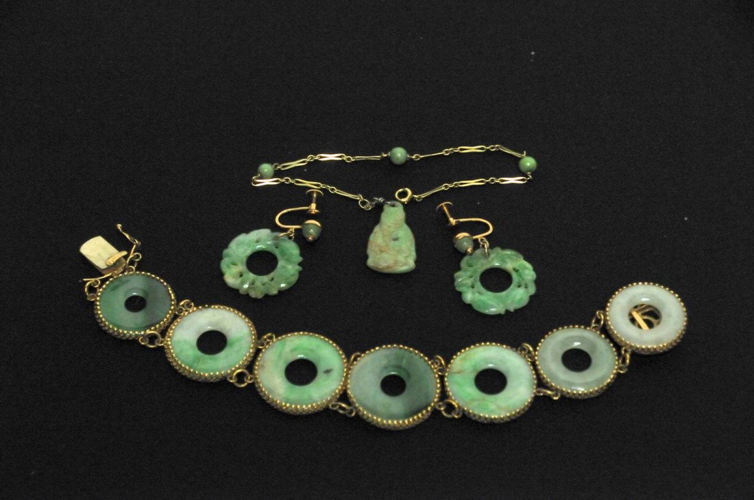 Vintage Jade Earrings, Bracelet, Watch Chain: 1. Carved and pierced jade drop donut earrings in the shape of Chinese coins; marked "14K Naomi"; 2. 14 kt. yellow gold link bracelet consisting of seven jade donuts in graduating sizes; clasp marked 