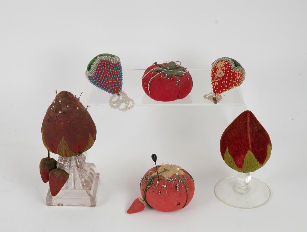 Sewing Related--Needle Case, Make-Do, Iroquois: Including: Finely turned wooden needle case, footed urn form with lid having delicate finial, 19th century; 4 1/8"H; good condition---Two make do pin cushions comprised of hand sewn strawberry pin cus