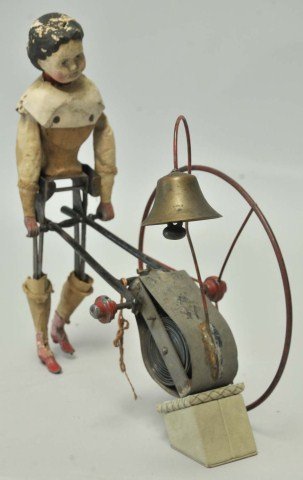 Partial Automaton Walking Papier Mache Doll: 19th century automaton in as found condition having doll with papier mache head and bust on wooden torso with metal hands, legs and feet, cloth arms; pushing a cart ringing a bell; doll 11"H; cart and